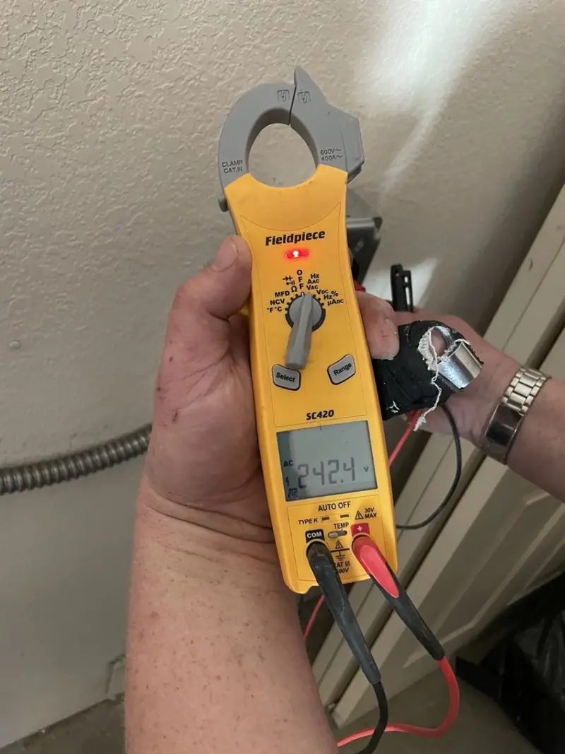 Voltage testing with clamp meter during Ceiling Fan Installation in Murray